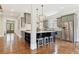 Open kitchen features a center island with seating, stainless steel appliances, and stone countertops at 3834 Chamblee Dunwoody Rd, Atlanta, GA 30341