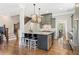 Spacious kitchen with large center island, stylish pendant lighting, and stainless steel appliances at 3834 Chamblee Dunwoody Rd, Atlanta, GA 30341