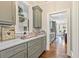 Kitchen with stone countertops, gray custom cabinets, and updated appliances at 3834 Chamblee Dunwoody Rd, Atlanta, GA 30341