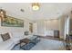 Cozy living room with wet bar, vaulted ceilings, a comfortable sofa, and a patterned rug at 3834 Chamblee Dunwoody Rd, Atlanta, GA 30341