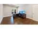 Bright home office space with a dark wood desk, dual monitors, and a door leading to the outside at 3834 Chamblee Dunwoody Rd, Atlanta, GA 30341