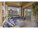 A covered outdoor patio features comfortable seating and a view of the backyard at 3834 Chamblee Dunwoody Rd, Atlanta, GA 30341