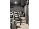 Home theater with comfortable seating, projector, and tiered levels for optimal viewing at 3834 Chamblee Dunwoody Rd, Atlanta, GA 30341
