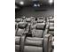 Home theater with large leather recliner chairs and projector for immersive movie experience at 3834 Chamblee Dunwoody Rd, Atlanta, GA 30341