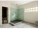 Bathroom shows a tiled shower with an open entry and a window, highlighting the space's functional design at 1115 Ralph Ne Rd, Atlanta, GA 30324