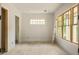 Bright bedroom featuring wooden trim windows, white walls, and light hardwood floors, creating a serene and inviting atmosphere at 1115 Ralph Ne Rd, Atlanta, GA 30324