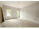 Airy bedroom featuring two bright windows and light walls, offers a tranquil space with ample natural light at 1115 Ralph Ne Rd, Atlanta, GA 30324