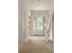 Bright entryway features white walls, light hardwood floors and a craftsman-style door with sidelights at 1115 Ralph Ne Rd, Atlanta, GA 30324