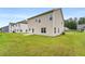 Grassy backyard view of the home featuring well-maintained lawn, perfect for outdoor enjoyment and entertaining at 228 Whitneys Way, Dallas, GA 30157