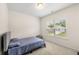 Comfortable bedroom featuring neutral carpet, window with blinds and a calming blue bed at 228 Whitneys Way, Dallas, GA 30157