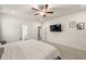 Comfortable bedroom with carpet, tv, and neutral walls with decorations at 228 Whitneys Way, Dallas, GA 30157