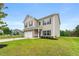 Inviting two-story home featuring neutral siding, brick accents, a two-car garage, and landscaped lawn at 228 Whitneys Way, Dallas, GA 30157