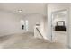 Upstairs landing with neutral carpeting and views into the bedrooms at 228 Whitneys Way, Dallas, GA 30157