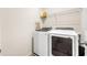 Well-equipped laundry room featuring washer and dryer set, with storage at 228 Whitneys Way, Dallas, GA 30157