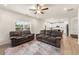Spacious living area with hardwood floors, recessed lighting, and an open layout connecting to the kitchen at 228 Whitneys Way, Dallas, GA 30157