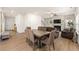 Inviting living room and dining area with hardwood floors, a fireplace, and comfortable seating at 228 Whitneys Way, Dallas, GA 30157