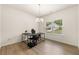Bright home office with wood floors, large window, modern desk, and chandelier lighting at 228 Whitneys Way, Dallas, GA 30157