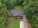 Aerial shot of home with green yard, covered front porch, and extended driveway at 3510 Dunn Se St, Smyrna, GA 30080