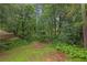 Expansive backyard with lush trees and greenery, creating a private and serene atmosphere at 3510 Dunn Se St, Smyrna, GA 30080