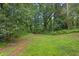 Generous backyard area surrounded by trees and greenery at 3510 Dunn Se St, Smyrna, GA 30080