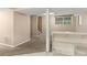 Open basement space with carpet, bar, and partial view of stairs at 3510 Dunn Se St, Smyrna, GA 30080