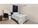 Cozy bedroom featuring neutral carpet, a vanity, and a comfortable bed setup at 3510 Dunn Se St, Smyrna, GA 30080