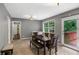 Bright dining room with table set, plenty of natural light, and deck access at 3510 Dunn Se St, Smyrna, GA 30080