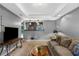 Cozy living room featuring neutral colors, a comfortable sofa, and a flat screen television at 3510 Dunn Se St, Smyrna, GA 30080