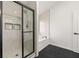 Bathroom with glass-enclosed shower and separate soaking tub at 3524 Preserve Run Trl, Loganville, GA 30052