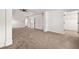 A bright bedroom with neutral carpet, white trim and access to a walk-in closet at 3524 Preserve Run Trl, Loganville, GA 30052