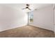 Bedroom featuring neutral carpeting, a ceiling fan, and a bright window providing natural light at 3524 Preserve Run Trl, Loganville, GA 30052