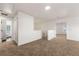 Versatile bonus room showcasing neutral carpeting with access to a restroom, staircase, and additional rooms at 3524 Preserve Run Trl, Loganville, GA 30052