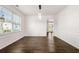 Inviting dining room with hardwood floors, wainscoting, and a bright window at 3524 Preserve Run Trl, Loganville, GA 30052