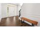 Welcoming foyer with hardwood floors, a wooden bench, and a view of the front door at 3524 Preserve Run Trl, Loganville, GA 30052