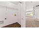 Laundry room featuring wire shelving, hookups, and easy access to additional living spaces at 3524 Preserve Run Trl, Loganville, GA 30052