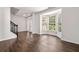 Bright living room with hardwood floors, bay windows, and elegant white trim at 3524 Preserve Run Trl, Loganville, GA 30052