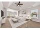Spacious main bedroom featuring a decorative ceiling, neutral color palette and sitting area at 3524 Preserve Run Trl, Loganville, GA 30052