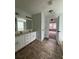 Bathroom featuring double sinks and tiled floors at 4069 Savannah Ridge Ct, Loganville, GA 30052