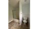 Bathroom features a shower, tiled floor, and a toilet at 4069 Savannah Ridge Ct, Loganville, GA 30052