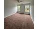 Generously sized bedroom features neutral walls, carpet, and bright windows that let in natural light at 4069 Savannah Ridge Ct, Loganville, GA 30052
