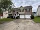 Charming two-story home featuring a brick facade, attached two-car garage, and inviting front steps at 4069 Savannah Ridge Ct, Loganville, GA 30052