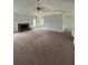 Spacious living room with a fireplace and ceiling fan at 4069 Savannah Ridge Ct, Loganville, GA 30052