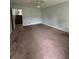 Room featuring carpet floors and a staircase at 4069 Savannah Ridge Ct, Loganville, GA 30052