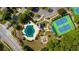 Aerial shot of the community pool and playground, surrounded by manicured grounds at 626 Dahoma Trail Trl, Woodstock, GA 30188