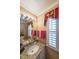 Well-lit bathroom with granite countertop vanity and framed mirror at 626 Dahoma Trail Trl, Woodstock, GA 30188