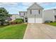 Charming two-story home with a well-manicured lawn and a two-car garage at 626 Dahoma Trail Trl, Woodstock, GA 30188
