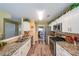 Bright kitchen featuring granite counters, stainless steel appliances, and hardwood flooring at 626 Dahoma Trail Trl, Woodstock, GA 30188