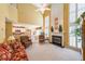 Bright living room with tall ceilings, large windows, fireplace, and comfortable seating area at 626 Dahoma Trail Trl, Woodstock, GA 30188