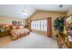 Bright main bedroom with vaulted ceiling, shutters, and carpet floors at 626 Dahoma Trail Trl, Woodstock, GA 30188