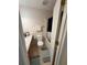 Bathroom features linoleum floors, patterned wallpaper, toilet, shower with curtain, and a vanity sink at 6550 Wellington Chase Ct, Lithonia, GA 30058